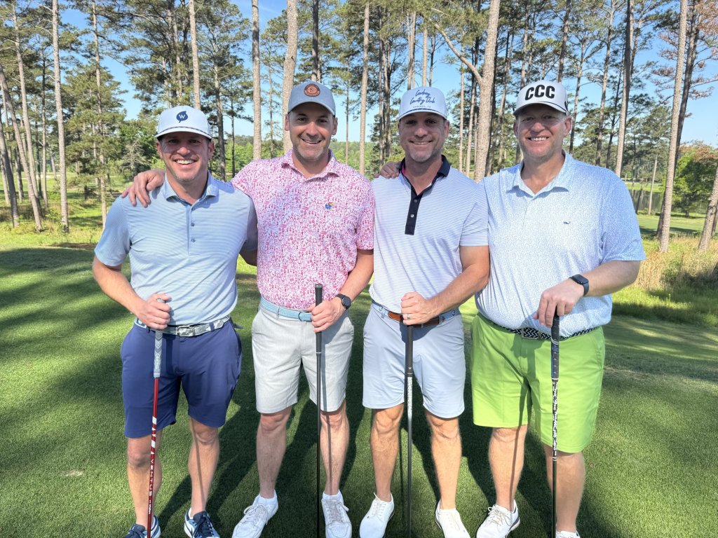 The group of four golfers standing together on the course at Grand National, Opelika, Alabama